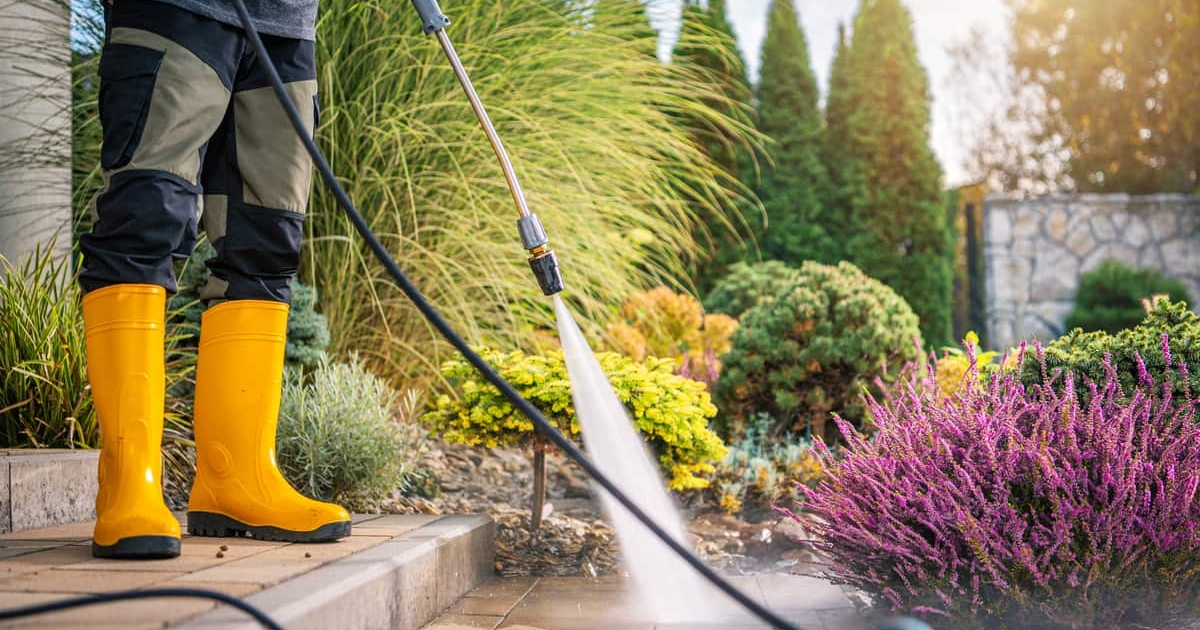 person-cleaning-patio-with-pressure-washer-during-2024-11-21-21-44-44-utc A+ Services | Pressure Washing in Sioux Falls